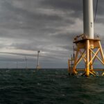 FIve offshore wind turbines in the ocean