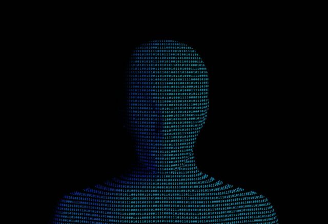 A silhouette of a person's head created using computer code.