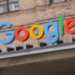 Google corporate logo hangs outside the Google Germany offices