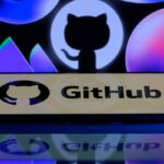 The GitHub logo is being displayed on a smartphone