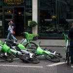 Fallen over Lime rental e-bikes parked on South Place near Liverpool Street in London.