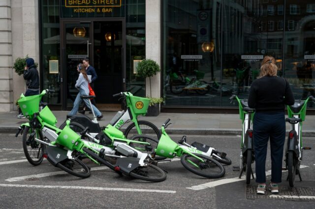 Fallen over Lime rental e-bikes parked on South Place near Liverpool Street in London.