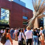 Students gather on a sunny US college campus.