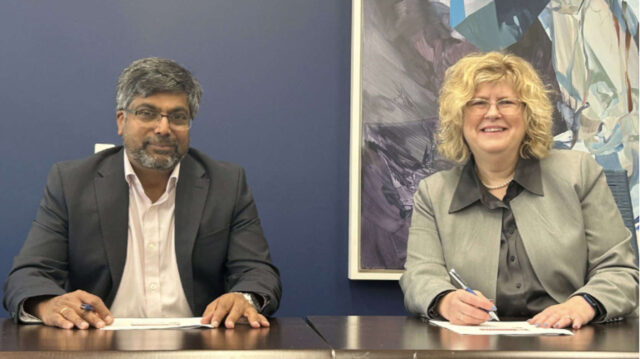 Professor Nishan Canagarajah and Dr Ann Marie Vaughan signing the MoU.