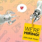 Two industrial robot arms, one holding a sign that says "We're hiring, join our team"