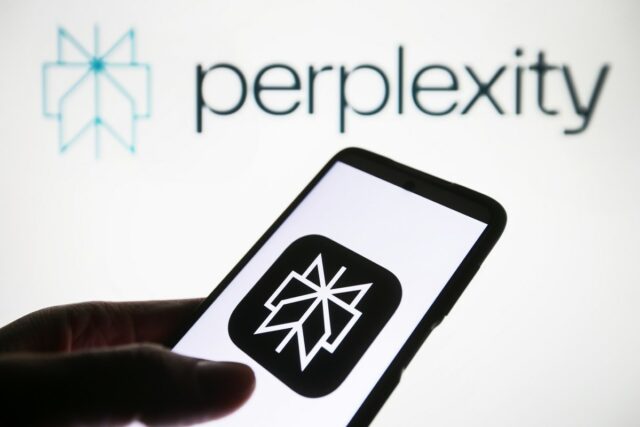 Perplexity AI logo is seen on a smartphone and on a PC screen.