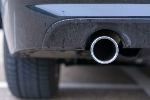 Low angle view of an exhaust pipe on a car.