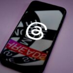 The Threads logo on a smartphone