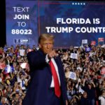 Donald Trump stands on stage during a campaign rally in Hialeah, Florida. He has won the disaster-prone state three times.