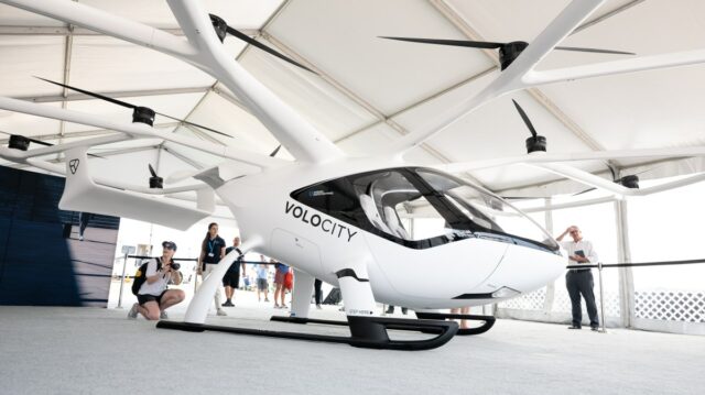 VoloCity mockup at the EAA AirVenture 2021 in Oshkosh. Visitors taking pictures of the VoloCity mockup