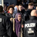 a woman speaks to police officers on potsdamer platz during an unannounced pro palestinian protest amid the ongoing conflict between israel and the palestinian group hamas in berlin germany october 22 2023 photo reuters