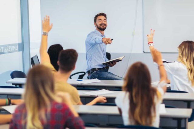 Teacher and students in a classroom.