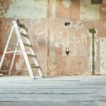 A step ladder standing in an empty domestic room mid renovation.