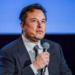 Tesla CEO Elon Musk looks up as he addresses guests at the Offshore Northern Seas 2022 (ONS) meeting in Stavanger, Norway on August 29, 2022