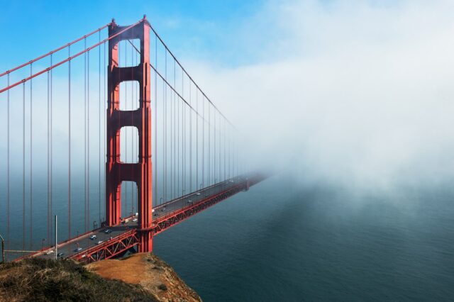 Red San Francisco Bay Bridge dissapearing in the almost always present mist in the Bay area.