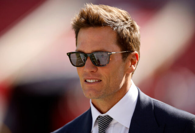 TAMPA, FLORIDA - JANUARY 05: Broadcaster Tom Brady looks on during warm ups prior to the game between the New Orleans Saints and the Tampa Bay Buccaneers at Raymond James Stadium on January 05, 2025 in Tampa, Florida. (Photo by Mike Ehrmann/Getty Images)