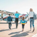 Family walking on runway.