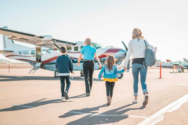 Family walking on runway.