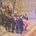 the remains of former us president jimmy carter are carried by an honor guard in washington dc photo afp