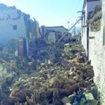 a cow stands on the rubble in shigatse in china s tibet region after an earthquake hit the area photo afp