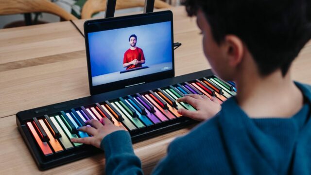 kid playing Roli