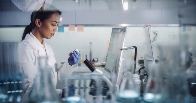 Female scientist working in lab.