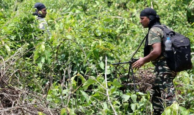 this photo taken on may 9 2018 shows indian military personnel patrolling in the saranda forest area in operations against maoist rebels in the west singhbhum district of india s eastern jharkhand state photo afp