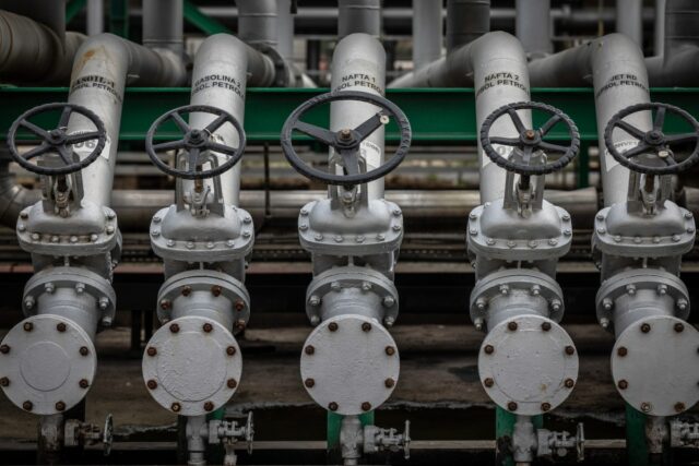 a series of valves and pipes of an oil refinery pipeline in the U.S.