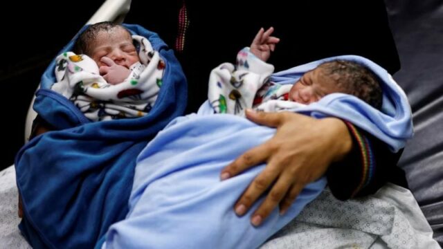 a palestinian woman iman holds her newborn twins in khan younis in the southern gaza strip 2 november photo reuters