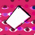 spyware illustrated; blank smartphone screen over a pink background of multiple eyes