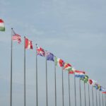 Line of flagpoles of different nationalities.